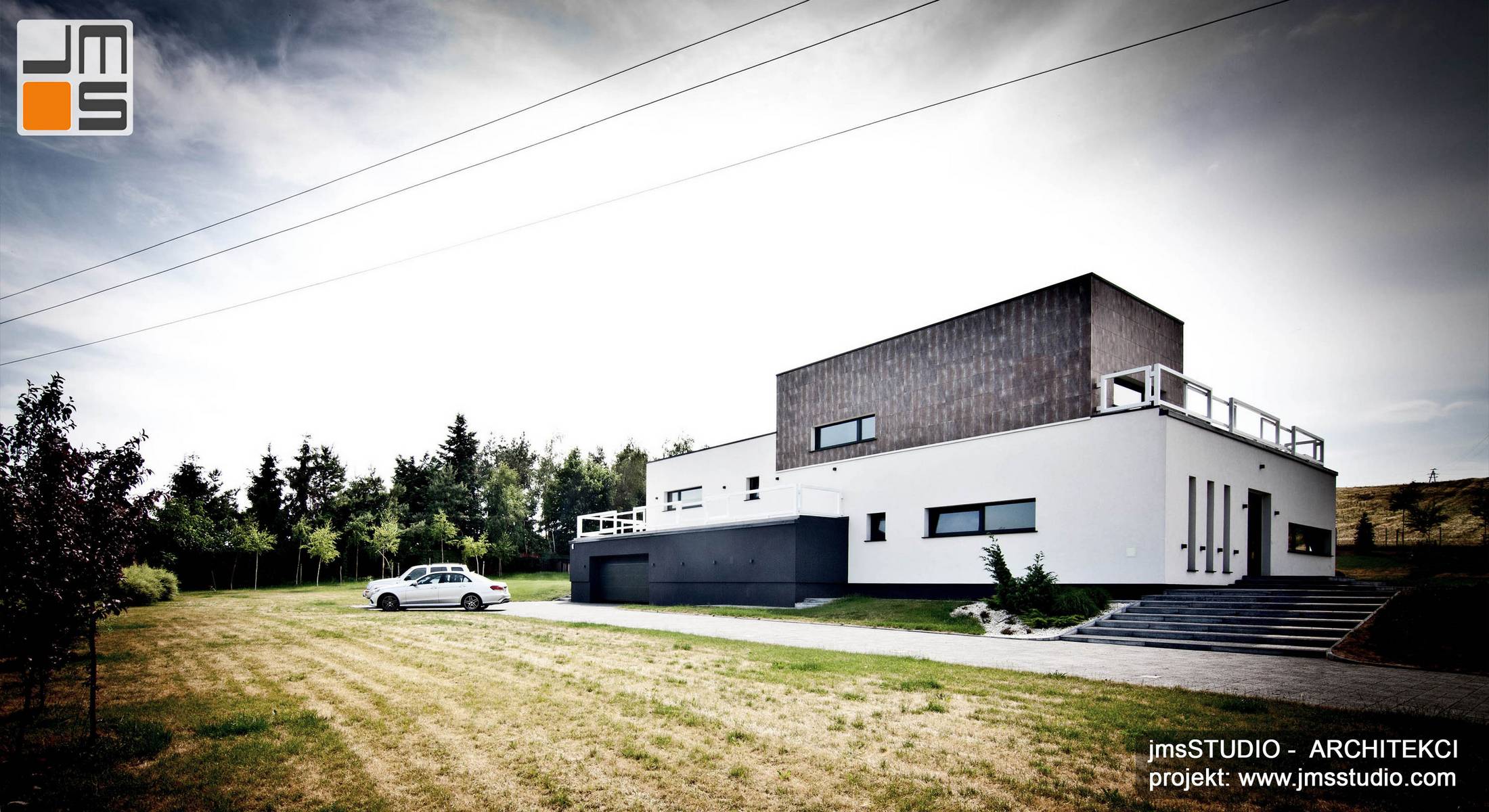 architekt_Kraków_projekt_nowoczesnego_domu_z_designerską_elewacją_z_brył_prostych_w_trzech_kolorach_z_gresem_na_elewacji_Poznań