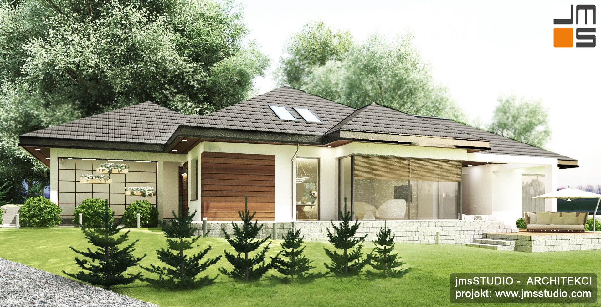 Z racji na działkę ze spadkiem dom jest na kilku poziomach, pojawiły się murki oporowe i schody terenowe.