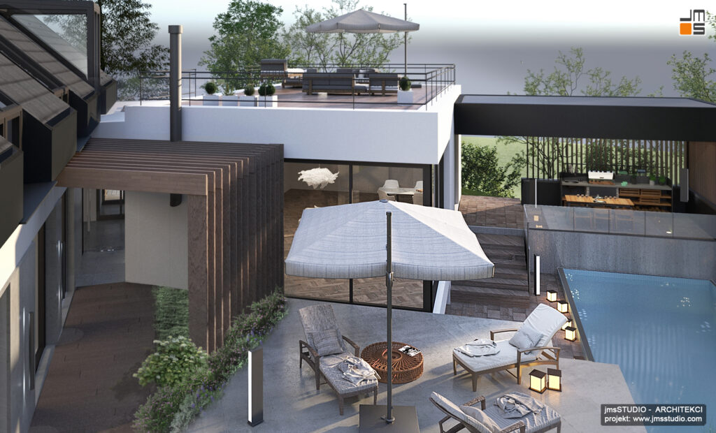 Dużą przestrzeń rekreacyjną z basenem zewnętrznym trzema tarasami i pergolą drewnianą zaprojektowano na kilku poziomach by wykorzystać działkę ze spadkiem