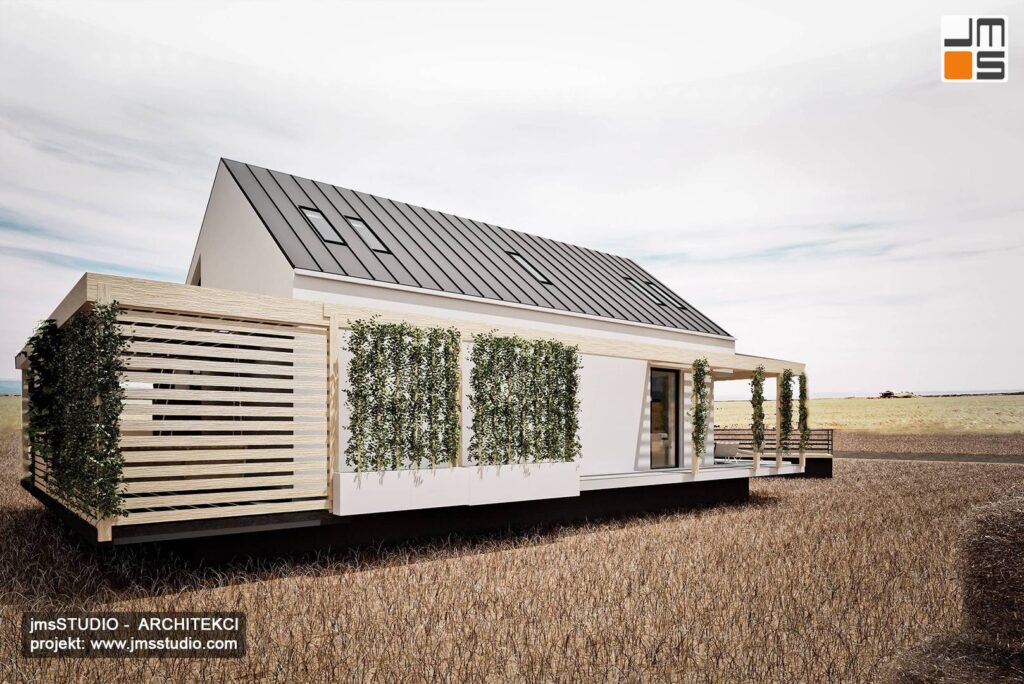 Dom modułowy z zieloną ścianą i pergolą oraz żaluzjami przeciwsłonecznymi to projekt domu architekt Śląsk